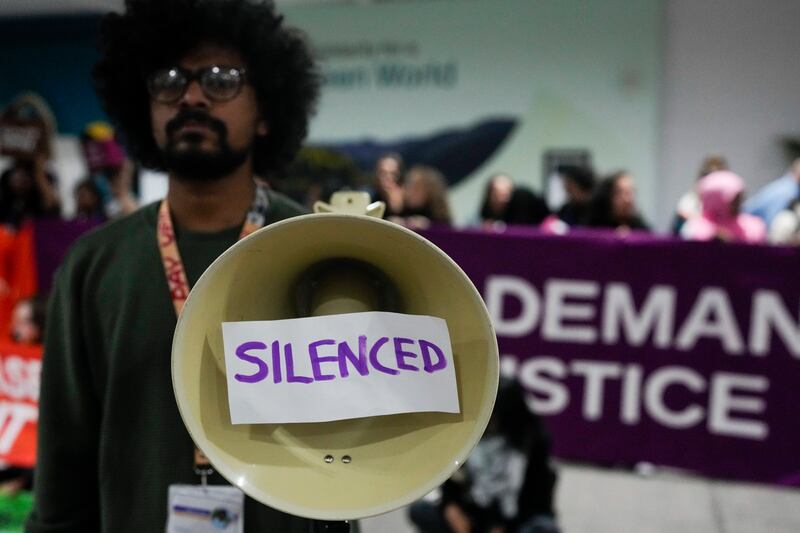 An activist makes their point in Baku, Azerbaijan (Rafiq Maqbool/AP)