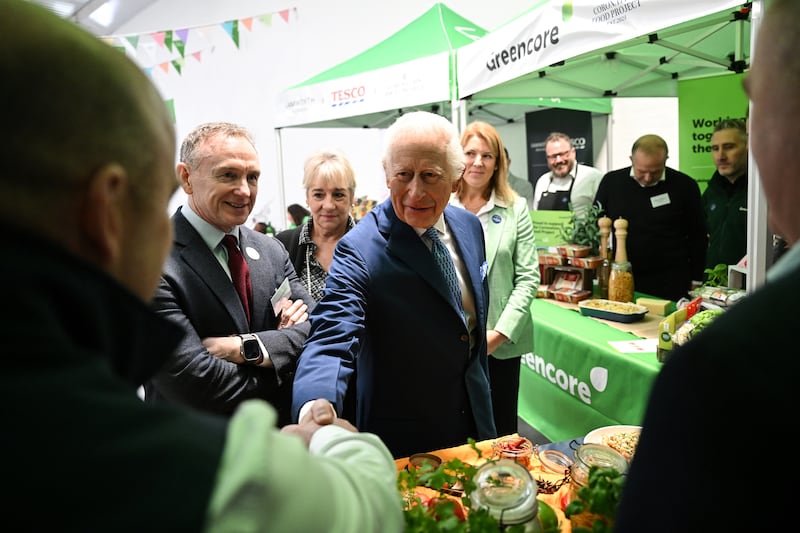 the King shakes hands with food suppliers at the Coronation Food Project hub in Deptford, south-east London