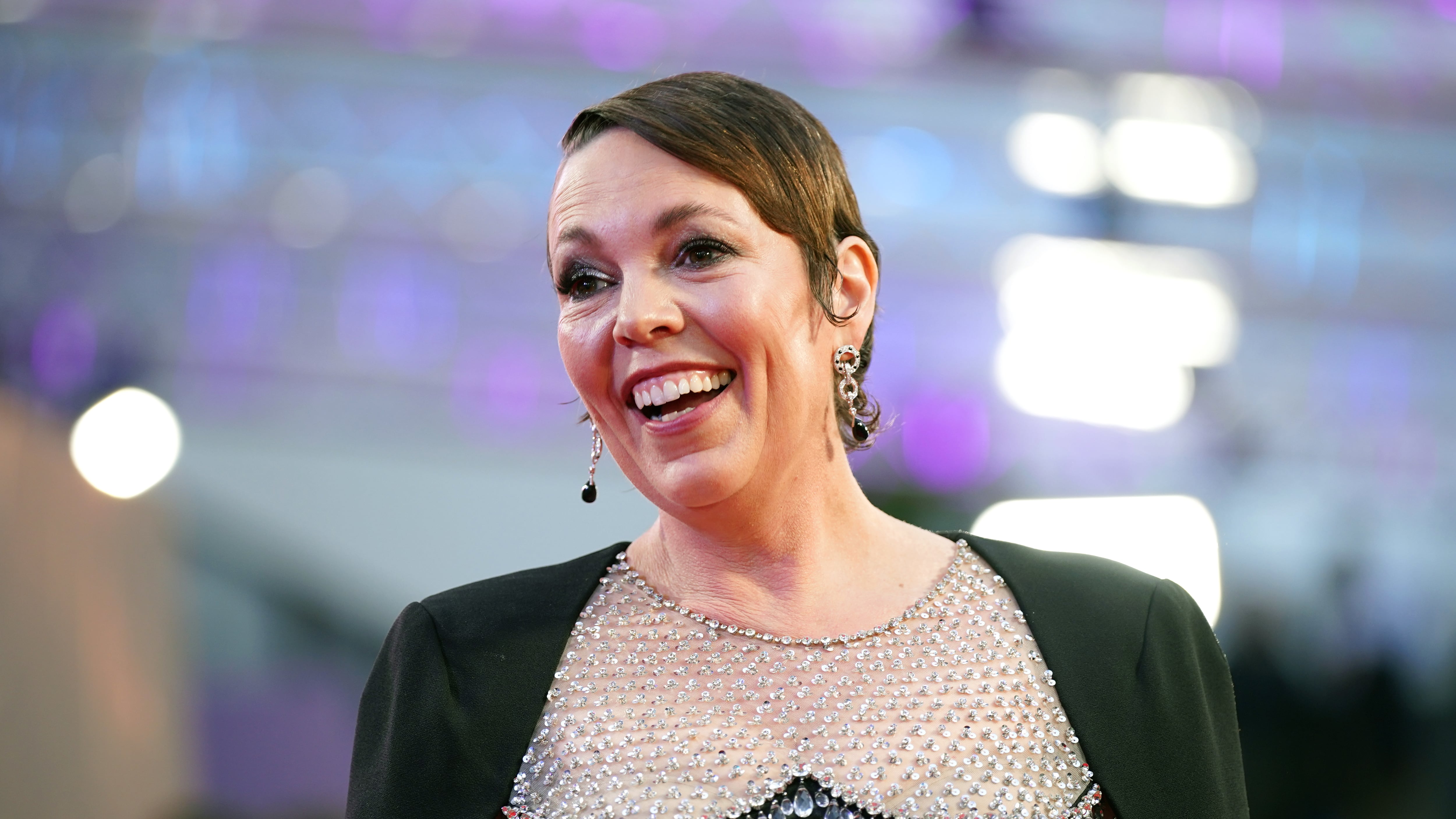 Olivia Colman has said she would be paid more if she was a man