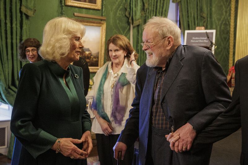 Queen Camilla speaking with poet Michael Longley at Hillsborough Castle in 2024