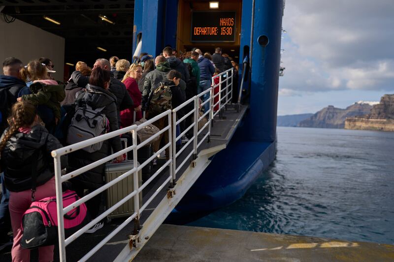 Thousands of residents and seasonal workers have left the island resort following the earthquake swarm (Petros Giannakouris/AP)