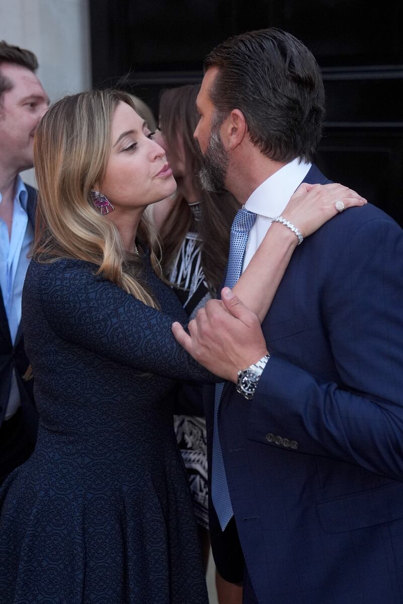 Holly Valance kisses Donald Trump Jr farewell as he leaves the fundraiser for his father in London