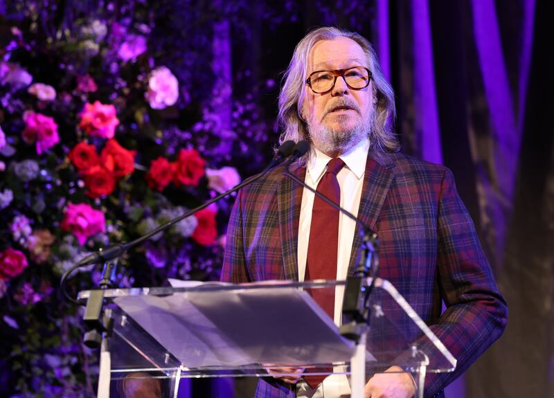 Gary Oldman performs on stage