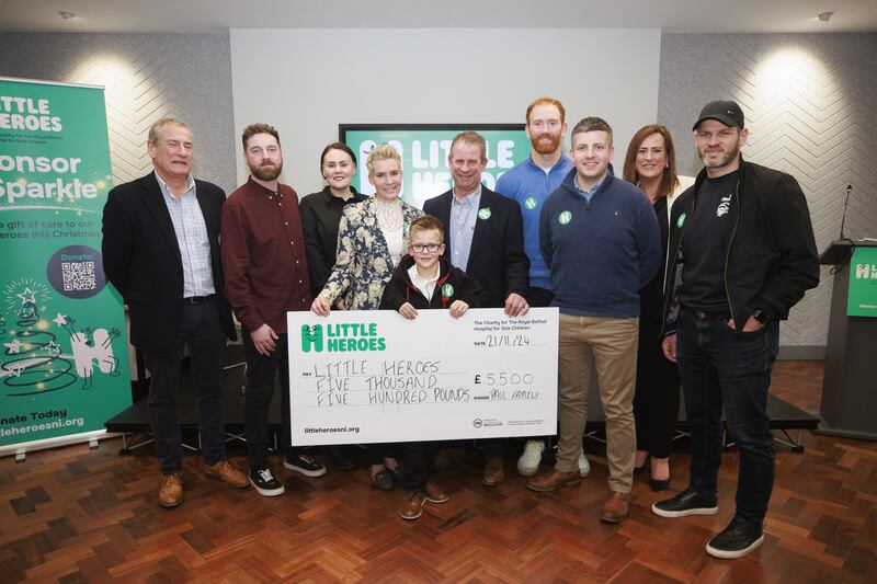 (Left to right) Ambassador Mark Huffam, Ryan and Nadine Chambers, Leanne, Cody and Alan Paul, ambassador Conor Glass, David Loughran, CEO Mary McCall, and Belfast Giants coach Adama Keefe during the launch of Little Heroes