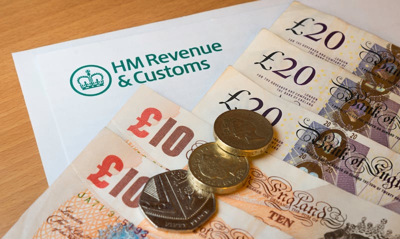 A HMRC (Her Majesty's Revenue and Customs) letter head surrounded by British bank notes and coins.