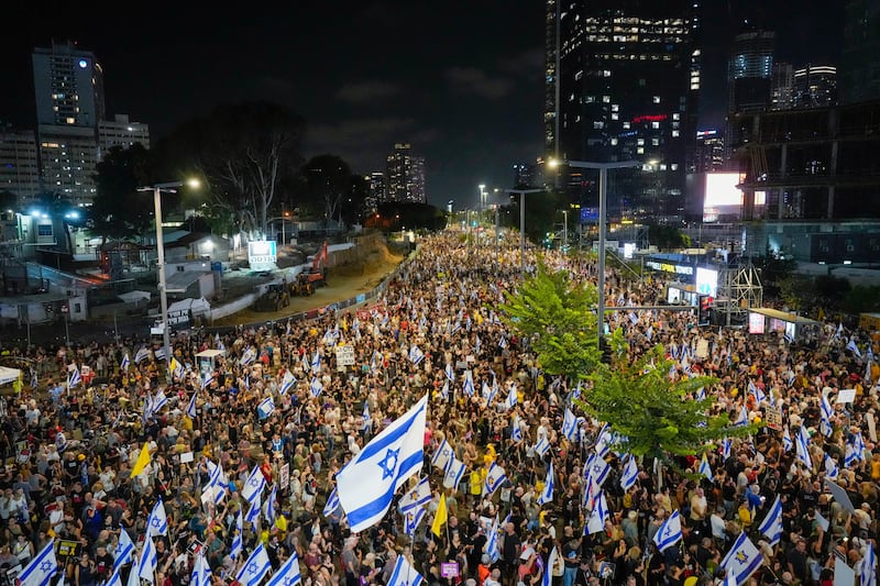 People protest against Prime Minister Benjamin Netanyahu’s government and call for the release of hostages held in the Gaza Strip by the Hamas militant group, in Tel Aviv, Israel, on Saturday (Ariel Schalit/AP)