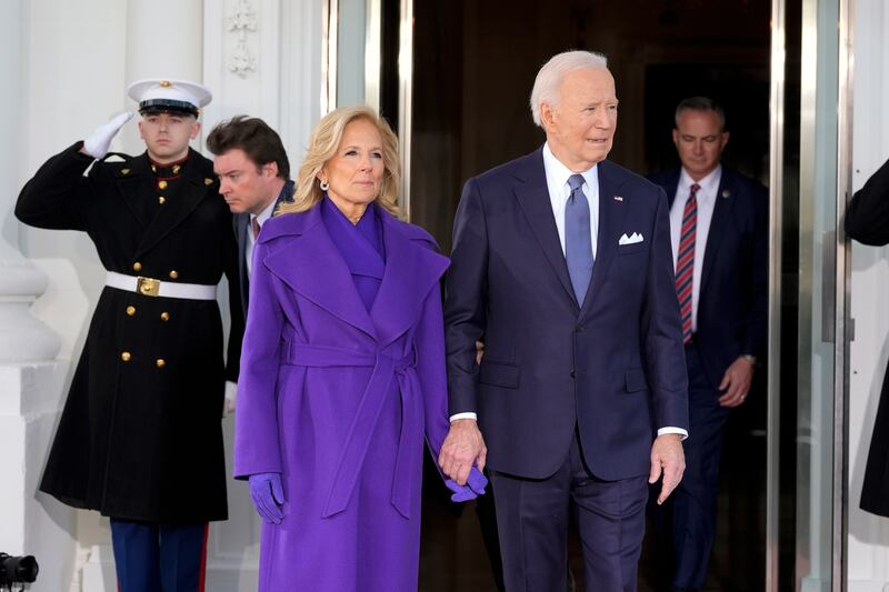 President Joe Biden and first lady Jill Biden await Mr Trump and his wife in the White House (AP)