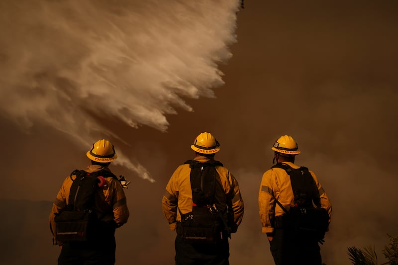 Firefighters have criticised the lack of water available after fire hydrants had run dry (Eric Thayer/AP)