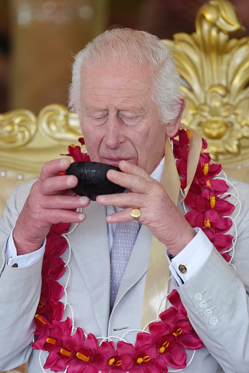 Charles drinks kava from a coconut shell