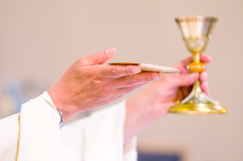 in the church wine becomes the blood of christ, and the host becomes the body of christ