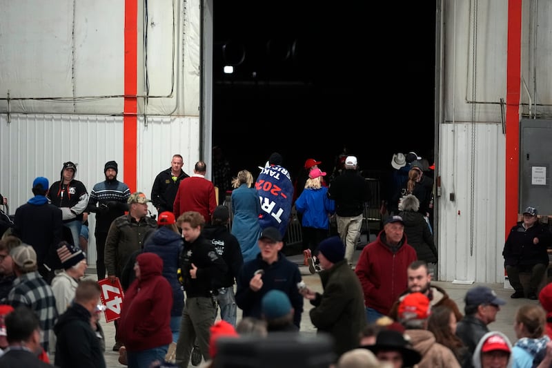 Attendees leaving a the Michigan campaign event before Donald Trump arrived on Friday (Paul Sancya/AP)