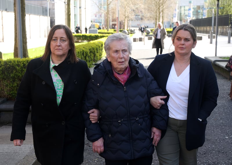 Bridie Brown, the wife of Sean Brown, with his daughters Siobhan Brown (left) and Claire Loughran (front right)  outside the Royal Courts of Justice, Belfast . PICTURE: MAL MCCANN