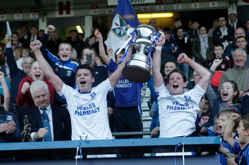 Cavan Gaels' joint-captains Eamonn Reilly and Martin Dunne lift the Cavan championship title in 2014. Dunne's few minutes at the end of the final win over Kingscourt were the only football he played that year after breaking three bones in his hand in the pre-match row with Armagh. Picture: Colm O'Reilly