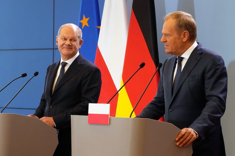 German Chancellor Olaf Scholz and Polish Prime Minister Donald Tusk attend a press conference after German-Polish inter-governmental consultations (Czarek Sokolowski/AP)