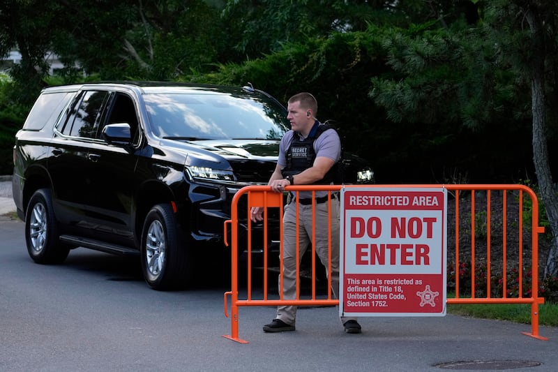 Law enforcement blocks off a street near President Joe Biden’s beach house (Matt Slocum/AP)