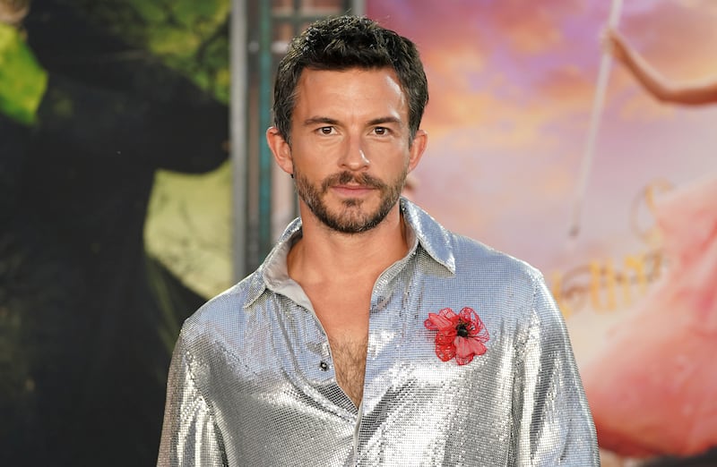 Jonathan Bailey wears a remembrance poppy to the premiere (Jordan Strauss/Invision/AP)