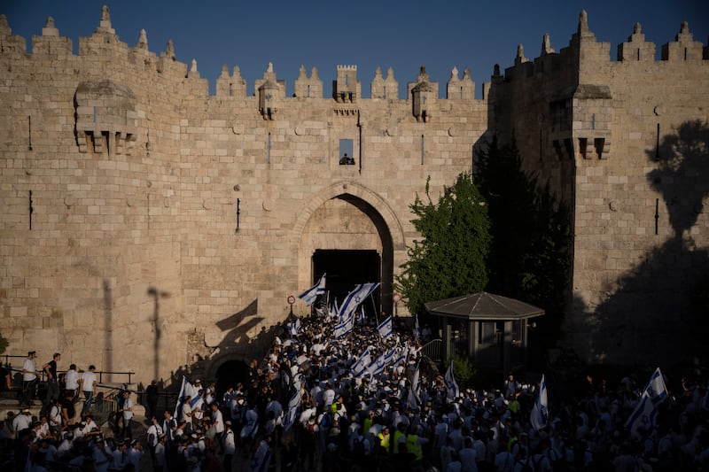 Israelis in front of the Damascus Gate of Jerusalem’s Old City (Leo Correa/AP)