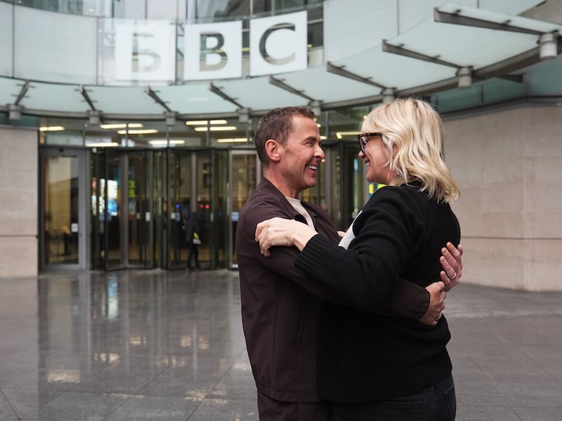 Zoe Ball and Scott Mills embrace outside New Broadcasting House in central London after Ball announced she is stepping down from the Radio 2 Breakfast Show after six years