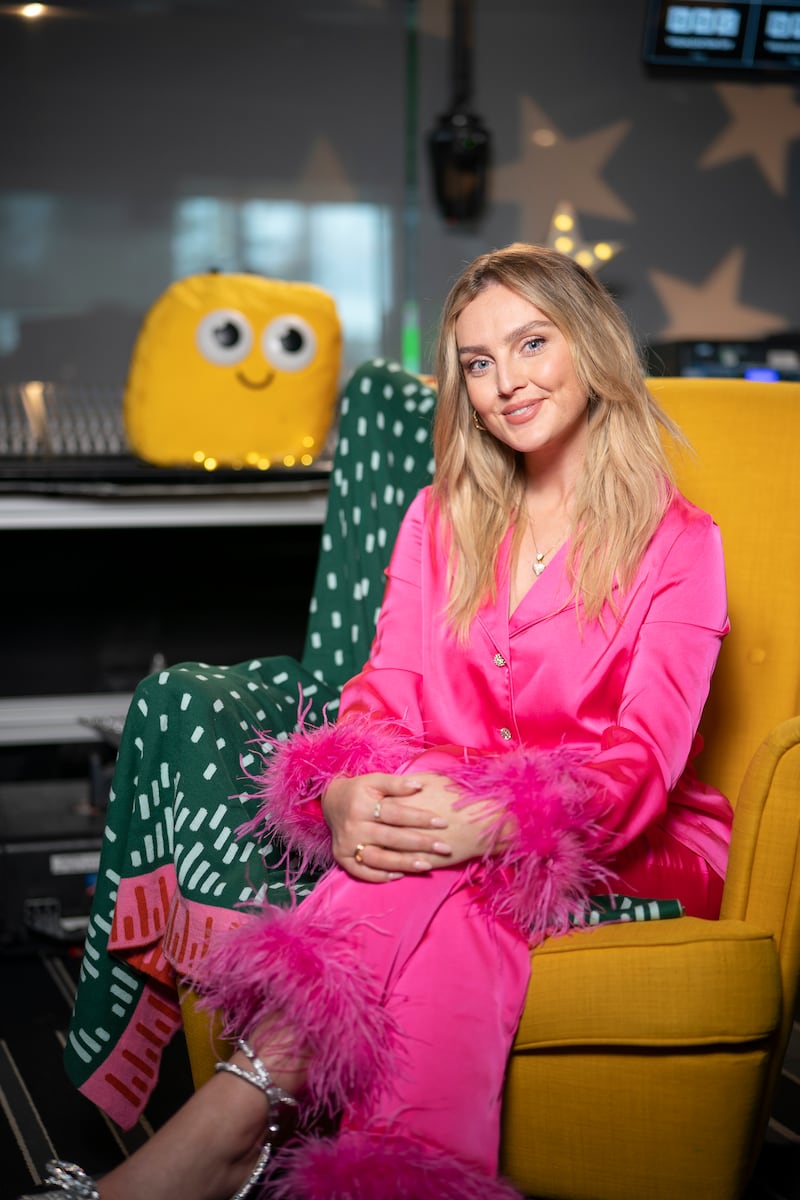 Perrie Edwards dons vibrant pink pyjamas with feather trim