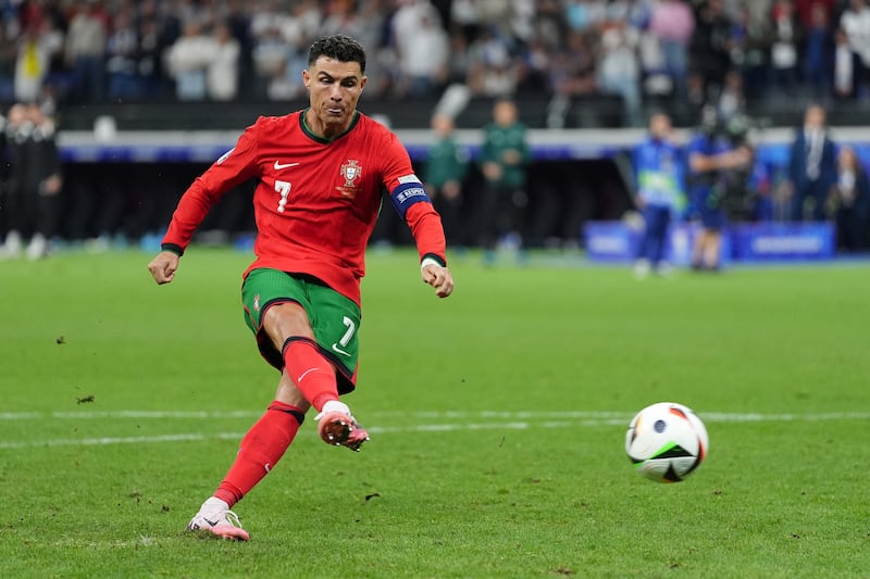 Cristiano Ronaldo scores in the penalty shoot-out against Slovenia
