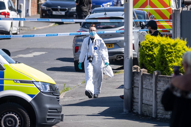 A police scenes of crime officer at the scene in Southport