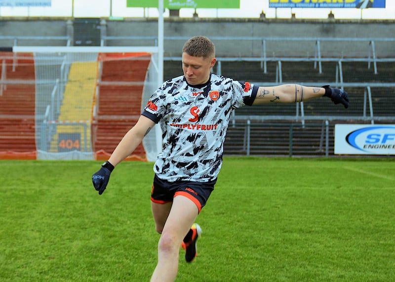 Blaine Hughes kicking in the new Armagh black and white goalkeeper jersey on the Athletic Grounds pitch