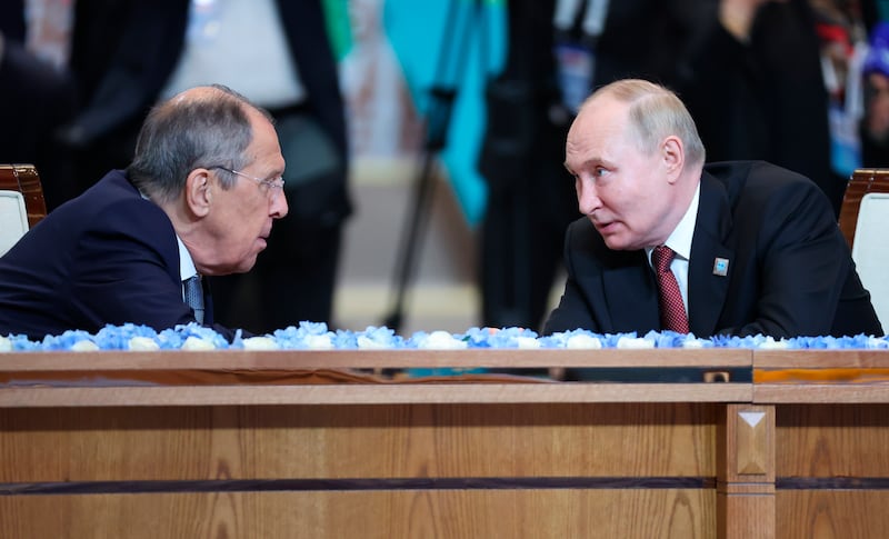 Mr Putin was joined by his foreign minister Sergei Lavrov (Kremlin Pool Photo via AP)