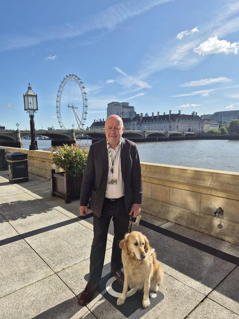 Liberal Democrat Steve Darling with his guide dog Jennie