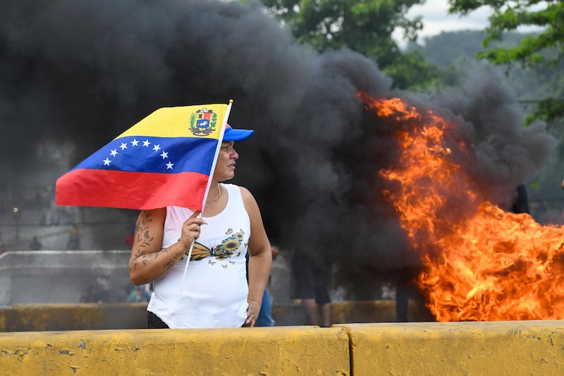 Protesters demonstrate against the official election results in Valencia, Venezuela (Jacinto Oliveros/AP)