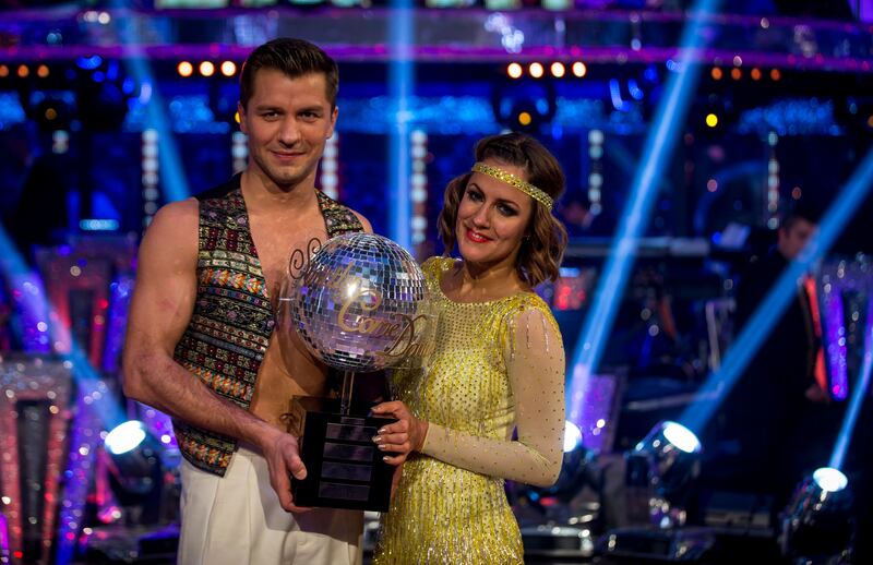 Caroline Flack lifting the Glitterball trophy with Pasha Kovalev