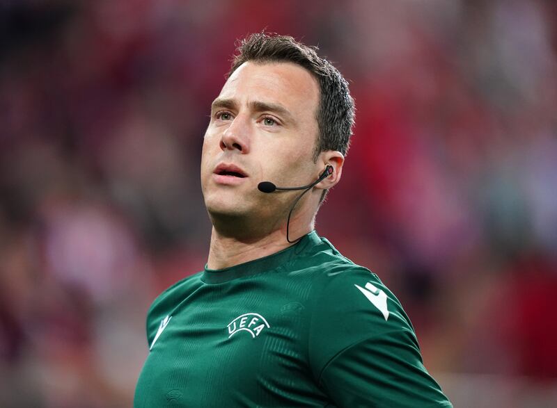 Referee Felix Zwayer warming up before the Europa Conference League semi-final second leg between Olympiacos and Aston Villa