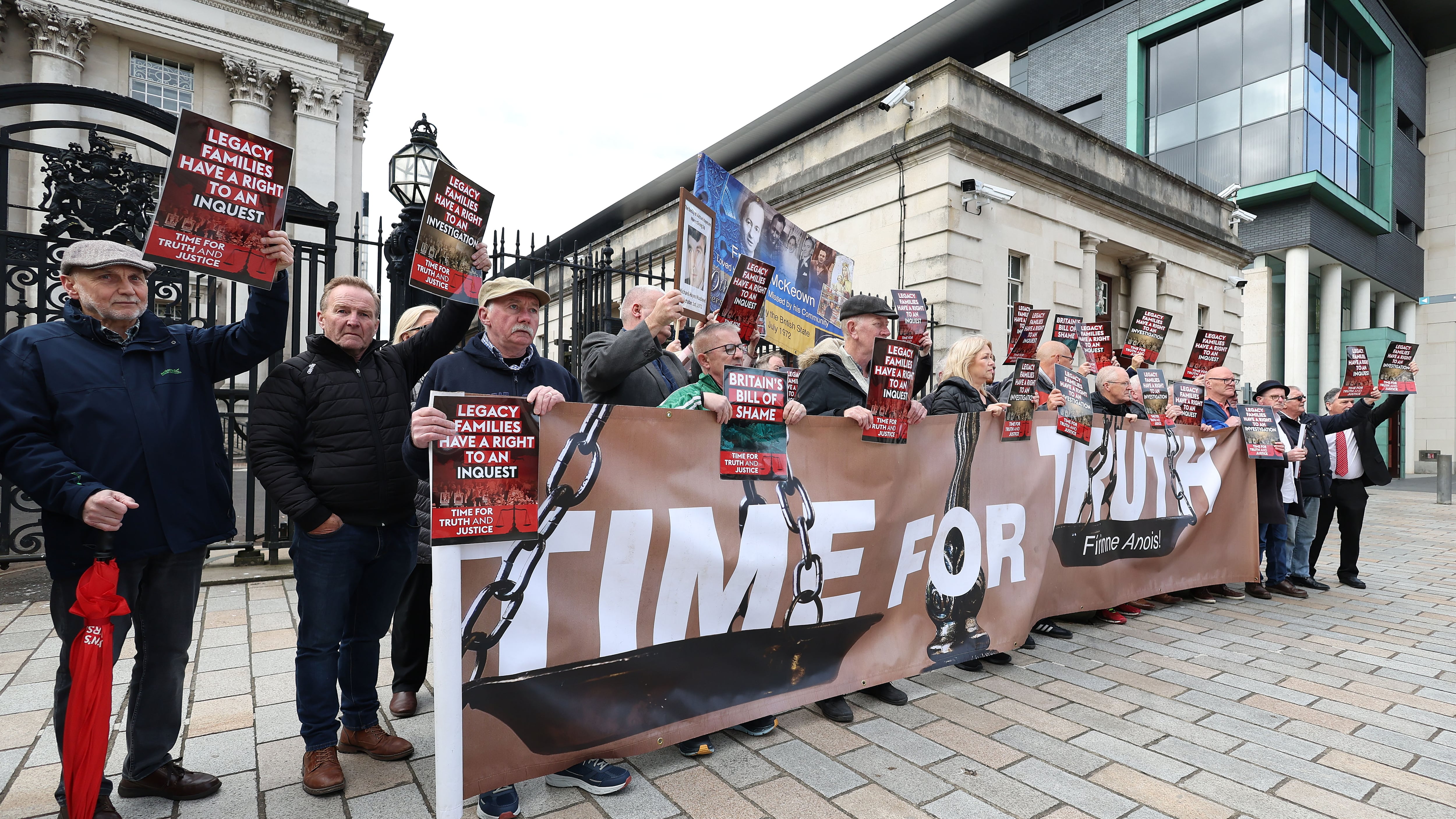 Legacy families protest before an  appeal against a High Court ruling over the UK Government’s Legacy Act takes place at Belfast High Cort on Tuesday.
PICTURE COLM LENAGHAN