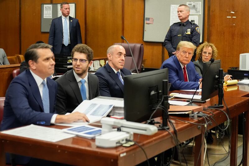 Former President Donald Trump, second from right, awaits the start of a pre-trial hearing (AP Photo/Mary Altaffer, Pool)