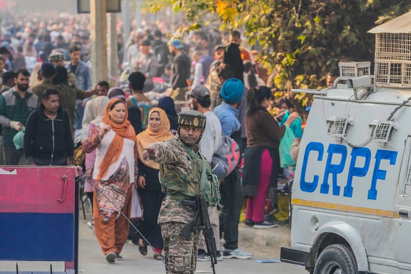 The market in Srinagar was bustling with shoppers (Mukhtar Khan/AP)