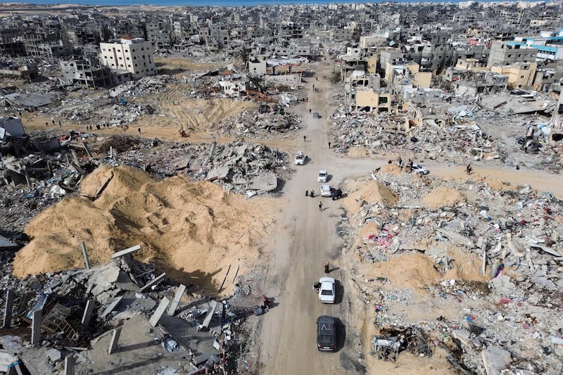 Many Palestinians did not wait for the ceasefire to come into effect before starting their treks home (Jehad Alshrafi/AP)