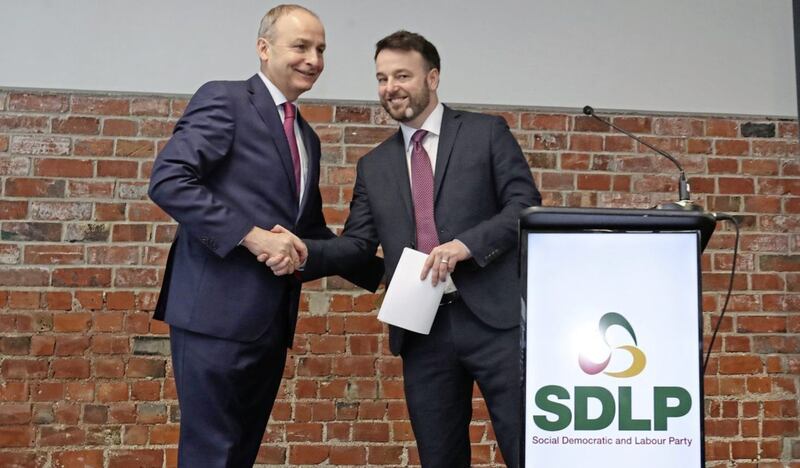 SDLP leader Colum Eastwood and Fianna F&aacute;il leader Miche&aacute;l Martin launching their parties&#39; partnership plan in Belfast last year. Picture by Niall Carson/PA 