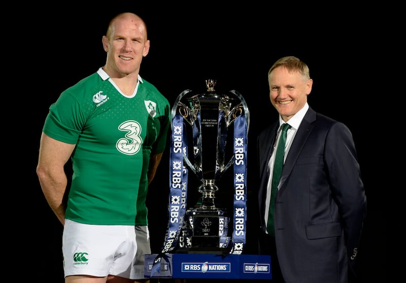 Former Ireland captain Paul O’Connell and head coach Joe Schmidt pose with the new Six Nations trophy