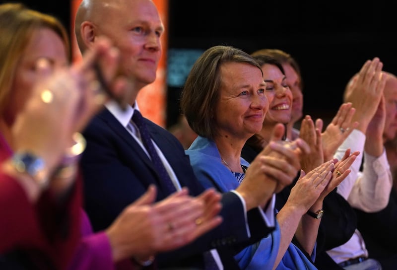 Sir Ed Davey’s wife Emily Gasson, centre right, was listening to her husband address delegates