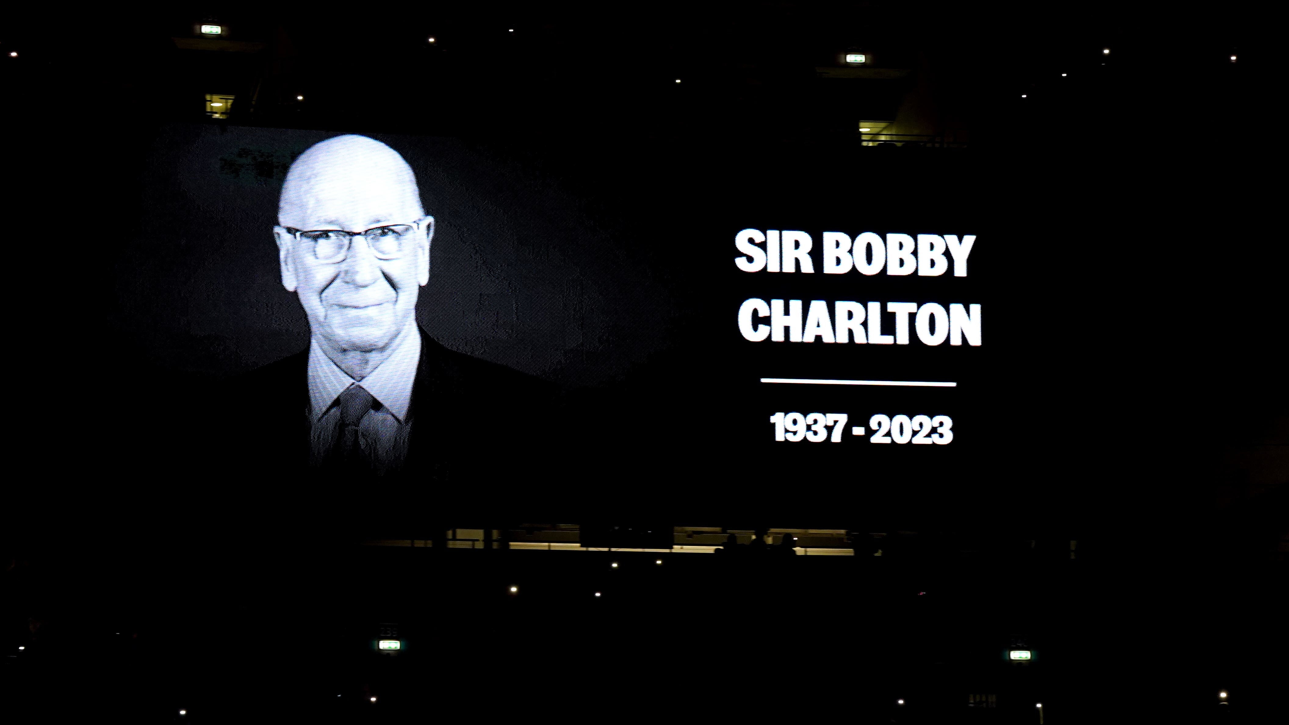 A tribute to Sir Bobby Charlton is shown on screen (Nick Potts/PA)