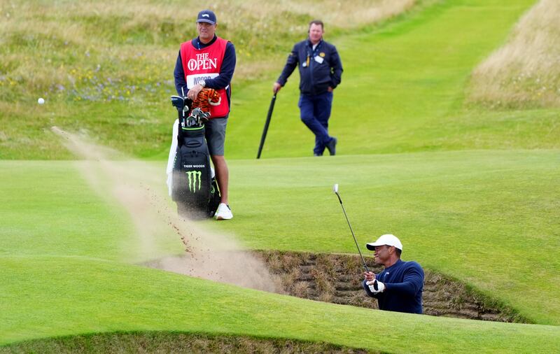 Tiger Woods failed to save par from a greenside bunker on the fifth as he headed for a missed cut in the 152nd Open