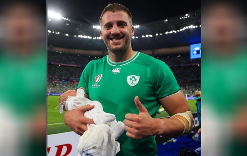 Stuart McCloskey pictured with his newborn son following Ireland's Rugby World Cup match against Scotland Photo: Ireland Rugby/Instagram