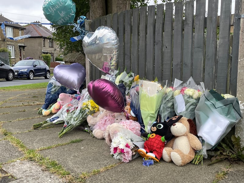 Flowers and tributes near the scene of a fatal house fire in Bradford