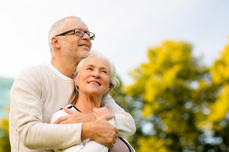 Senior couple hugging in the park