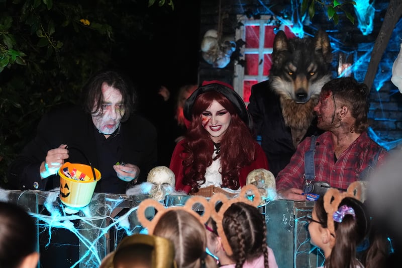 Jonathan Ross handing out sweets outside his house in north London