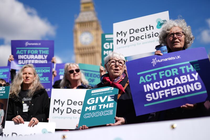 Campaigners in support of assisted dying protest outside Parliament in Westminster, London, in April 2024