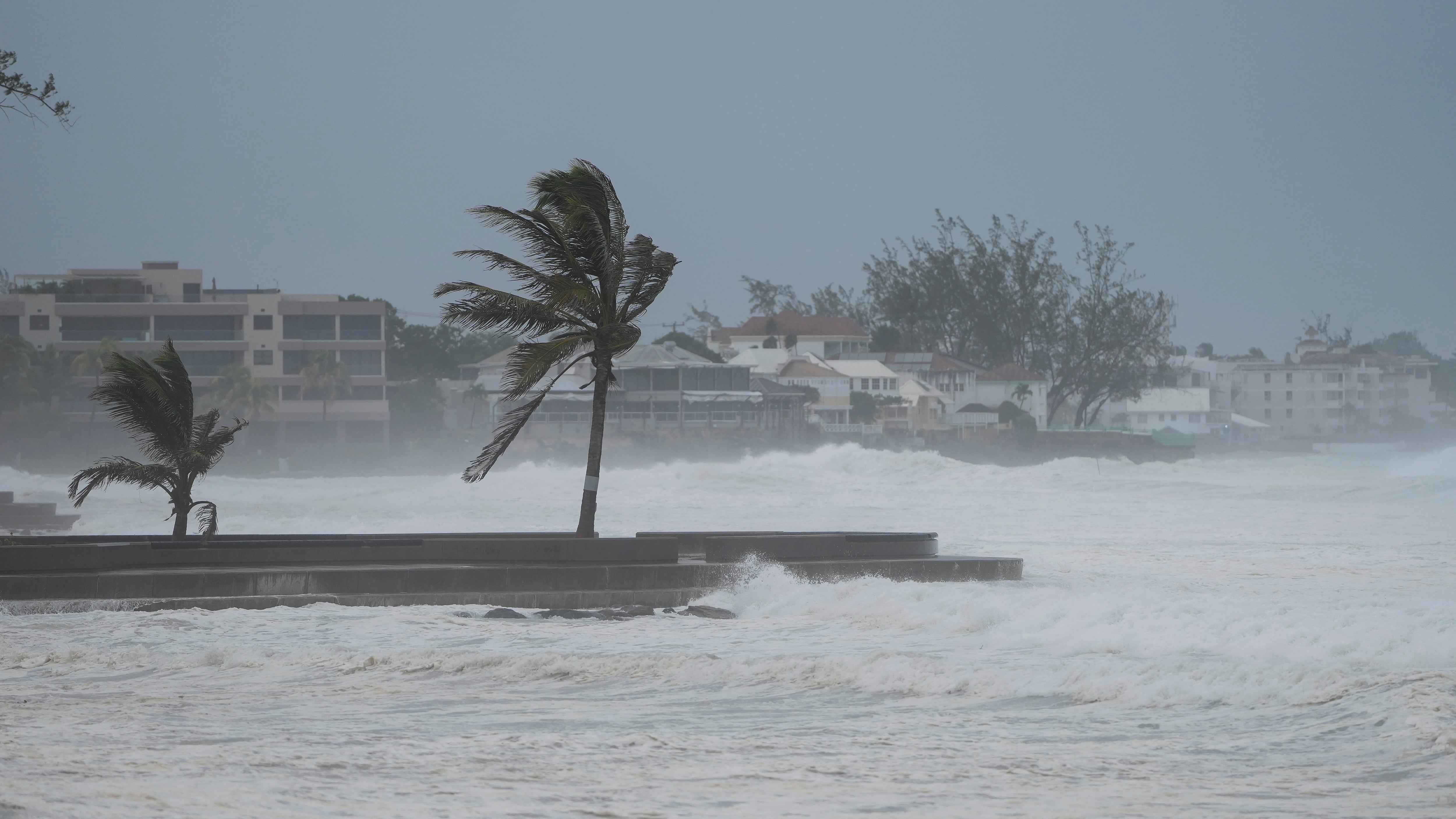 Waves batter a pier as Hurricane Beryl passes through Hastings, Barbados, on Monday (Ricardo Mazalan/AP)