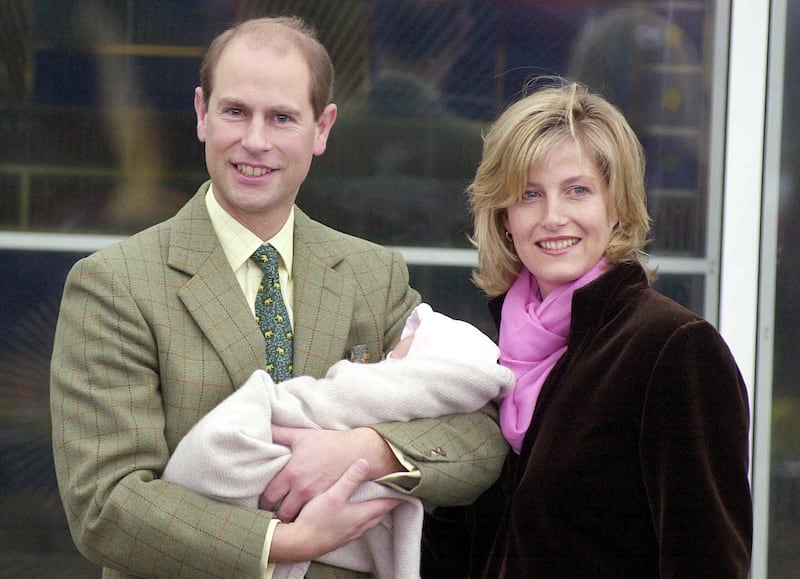 Edward, holding his baby daughter in his arms, and Sophie leave Frimley Park Hospital in Surrey in 2003