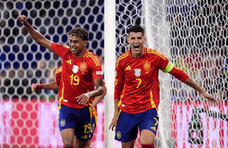 Spain’s Alvaro Morata and Lamine Yamal (left) celebrate after Italy’s Riccardo Calafiori’s own goal
