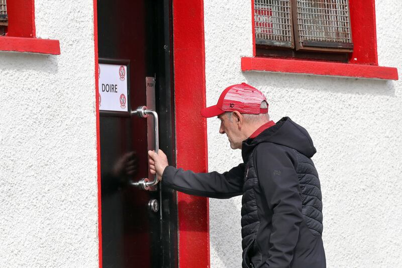 Mickey Harte enter the Derry changing room. Picture: Margaret McLaughlin
