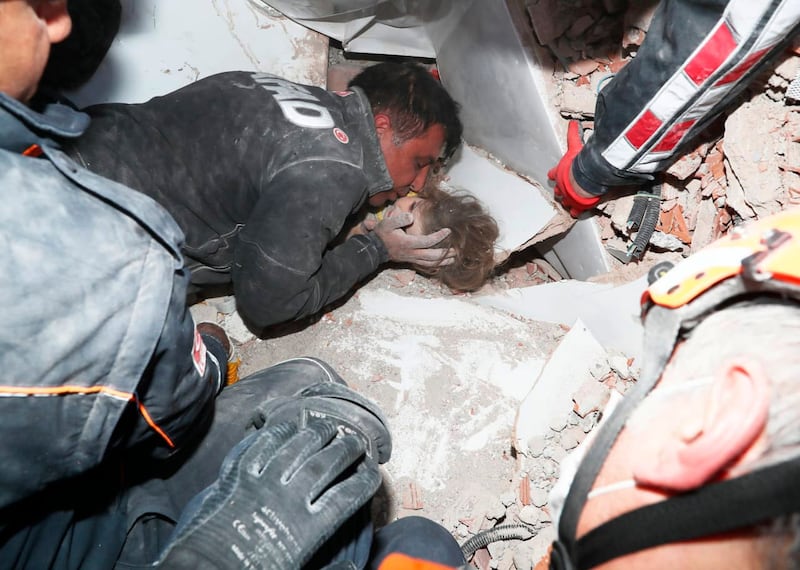 Rescue workers pull Ayda Gezgin from the rubble
